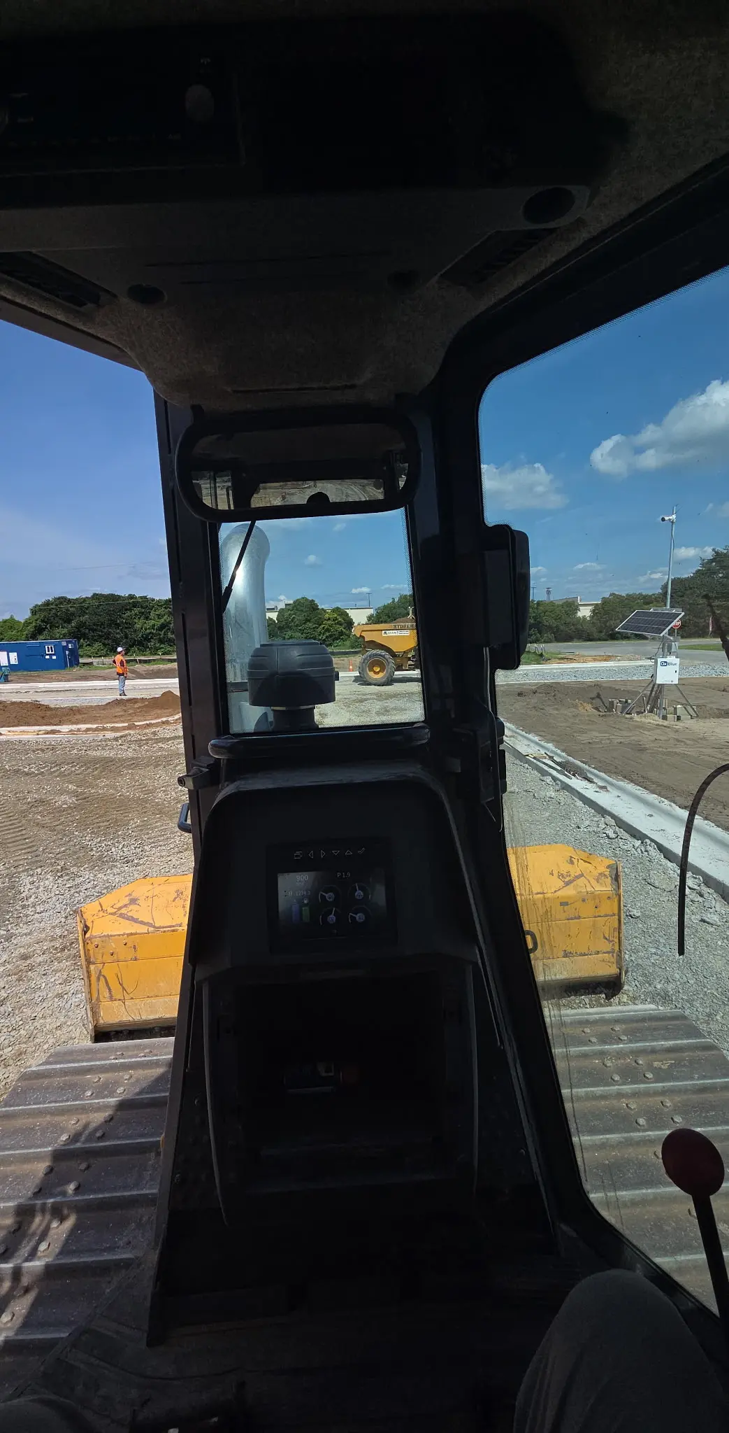 Heavy machinery performing site grading by Laser Construction